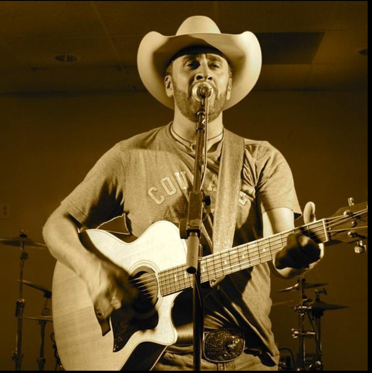 Rex Robards performing with acoustic guitar